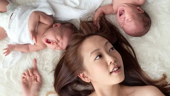 Woman with twin babies