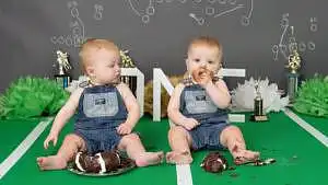 Twins eating cake